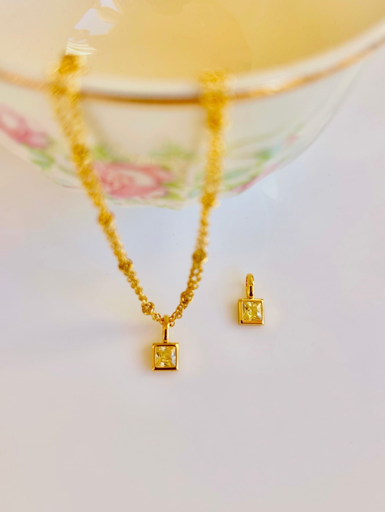 Gold August birthstone pendant necklace with peridot light green gemstone