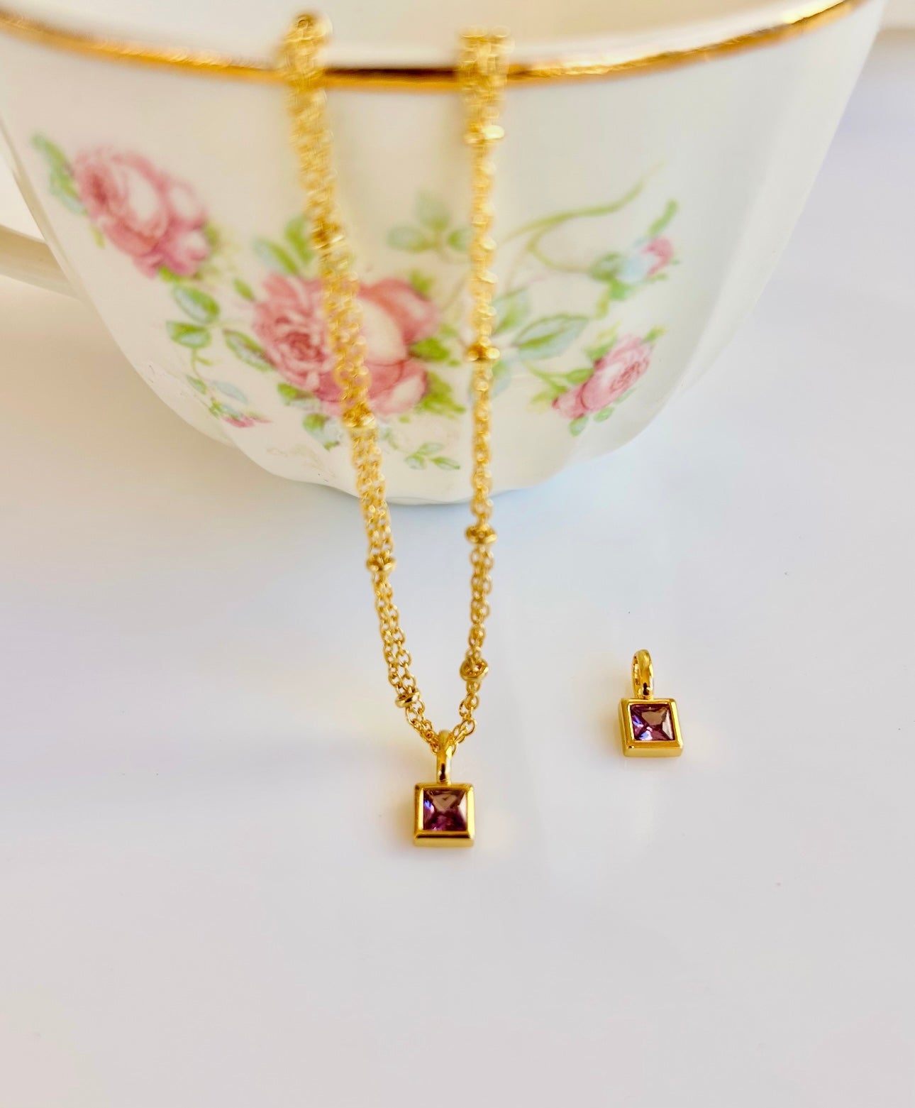 Gold February birthstone pendant necklace with amethyst purple gemstone